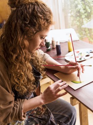 girl-painting-canvas-art-studio